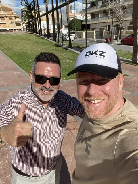 Two professionals take a thumbs-up selfie during an event · marketing and video agency for businesses in Sangonera la Verde